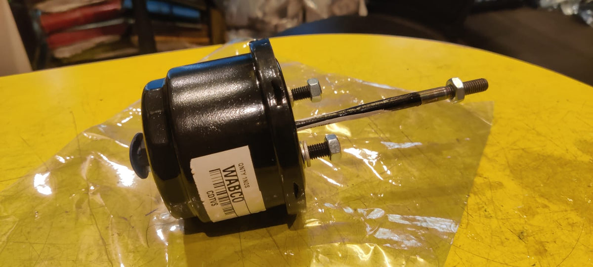 Motor on a yellow surface with a clear plastic bag
