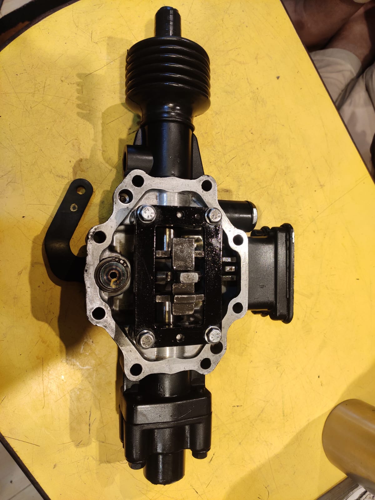 Mechanical component on a yellow surface