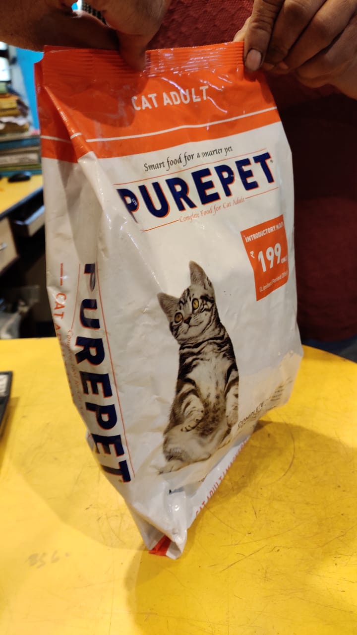 Bag of Purepet cat food on a yellow surface