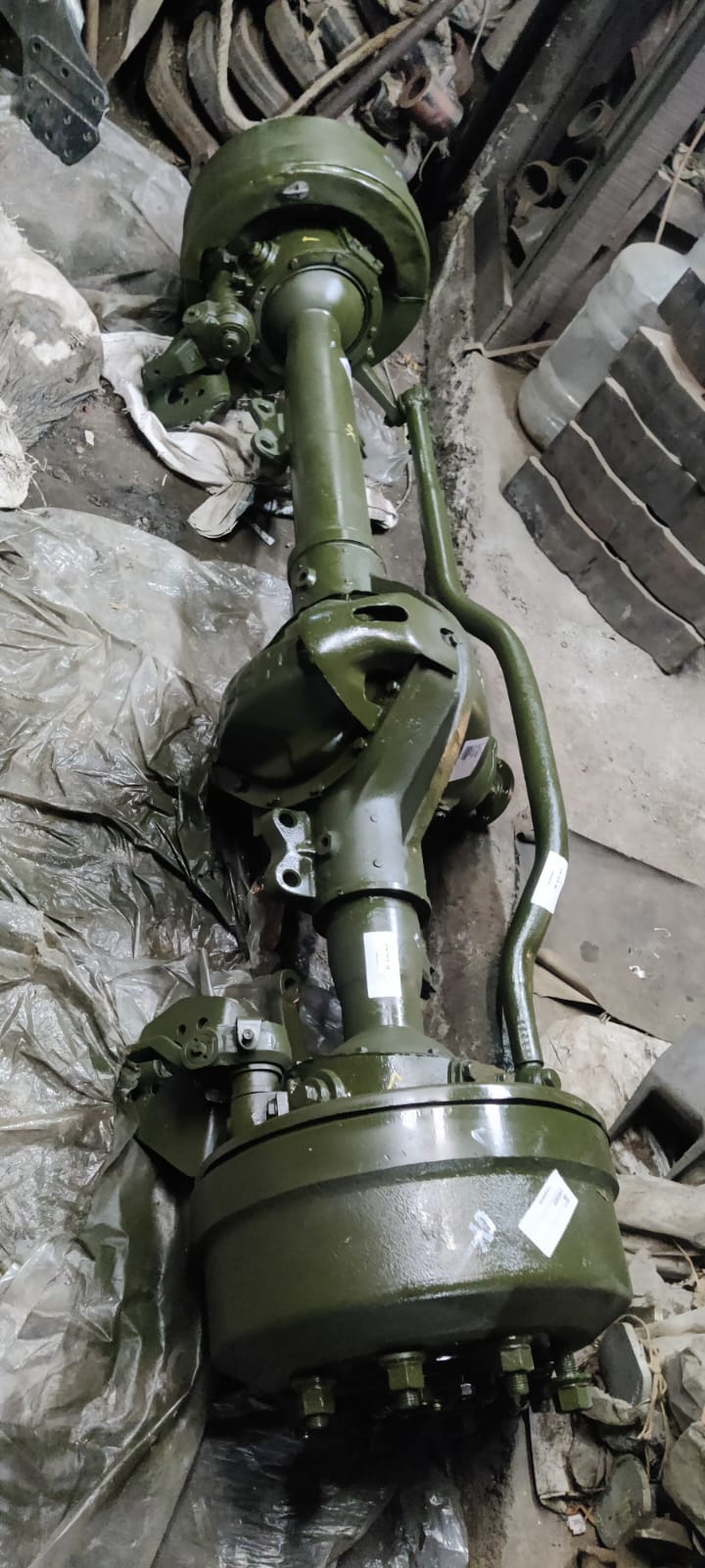 Green mechanical component on a cluttered background