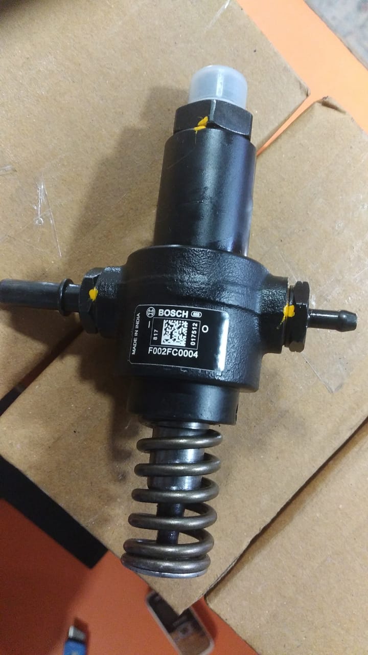 Mechanical component with spring on a cardboard background