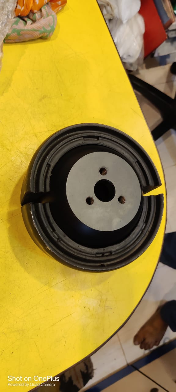 Black circular object on a yellow surface