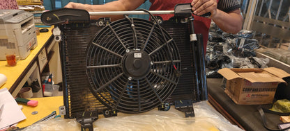 Radiator with fan on a workbench in a workshop setting