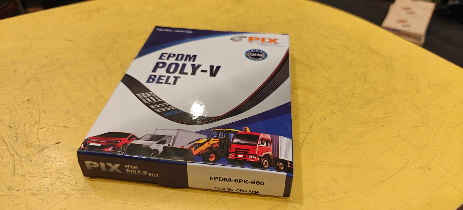 Box of PIX EPDM POLY-V belt on a yellow surface