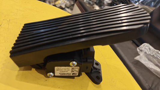 Black electronic component on a yellow surface