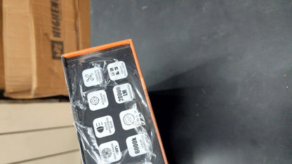 Black electronic device with labels on a dark surface