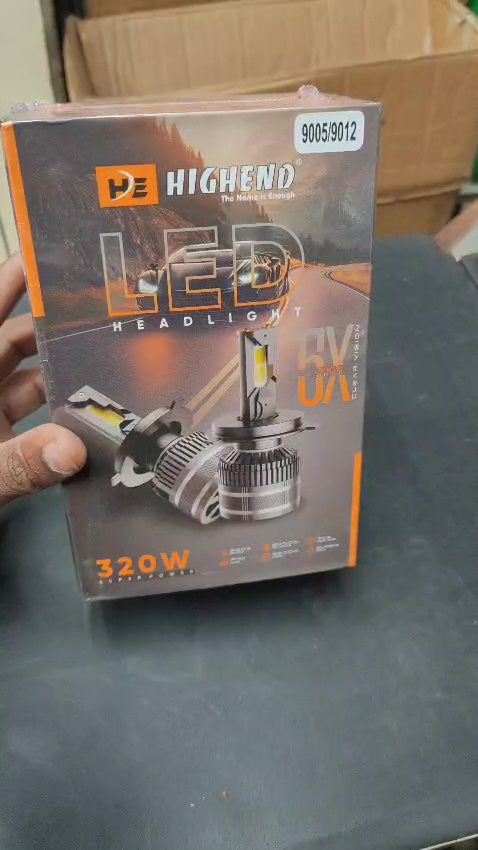 Highend LED Headlight box on a dark surface with a cardboard box in the background