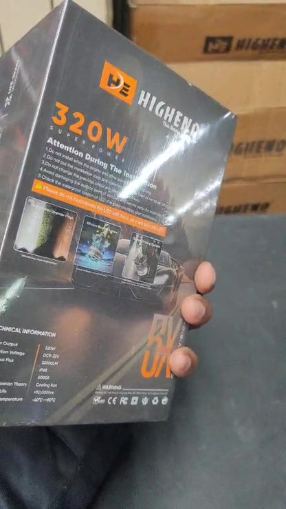 Highend power supply unit packaging held by a person with boxes in the background