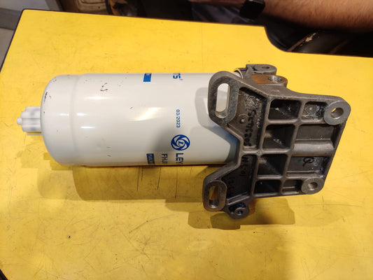 Mechanical filter or component on a yellow surface