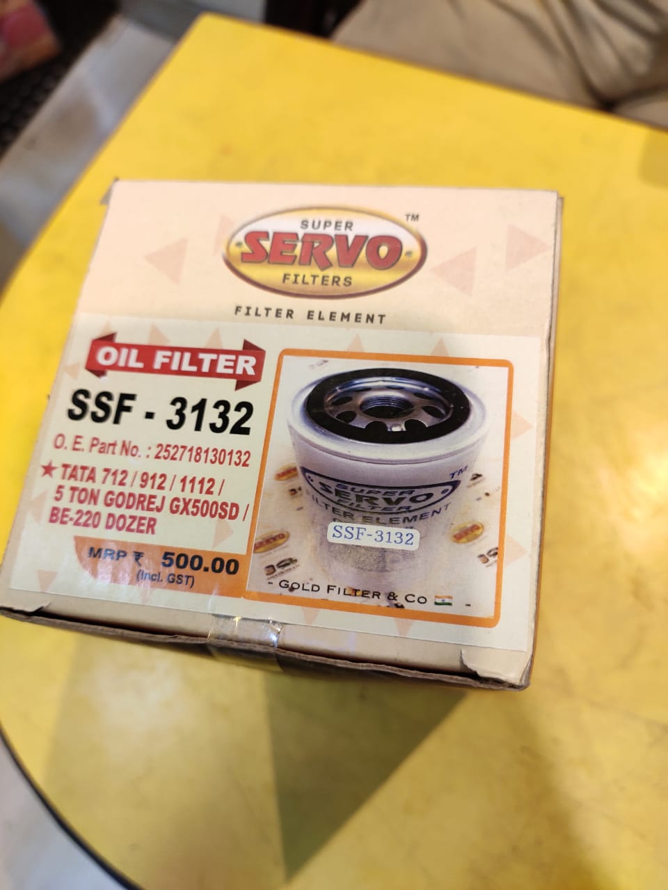 Super Servo oil filter packaging on a yellow surface