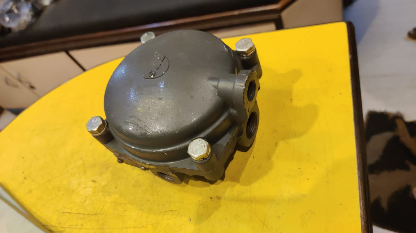 Mechanical component on a yellow surface