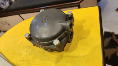 Mechanical component on a yellow surface