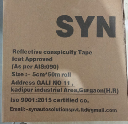 Cardboard box with reflective conspicuity tape details on a brown background