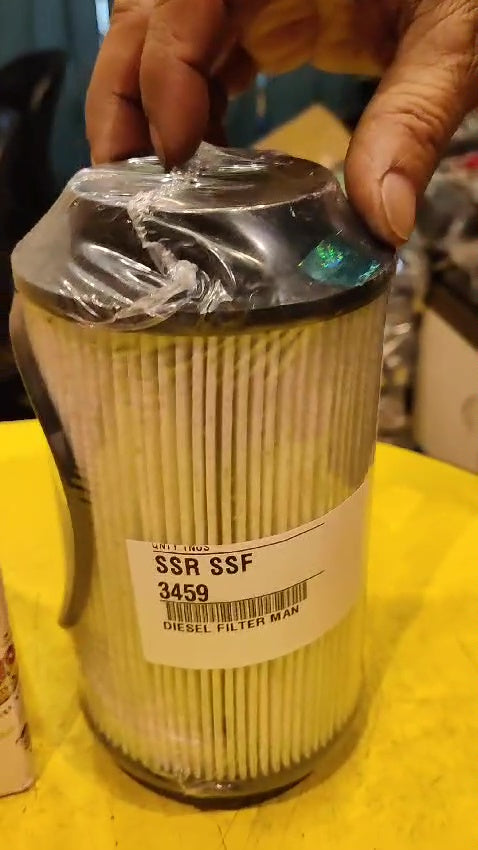 Diesel filter man with a label on a yellow surface